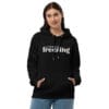 Woman in black "Literally Freezing" hoodie.