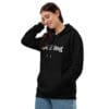 Woman in black "It's all freeing" hoodie.