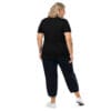 Woman in black shirt and pants, back view.
