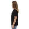 Woman in black t-shirt, side view.