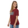 Woman in maroon t-shirt with art print.