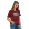 Woman in maroon t-shirt with artwork.