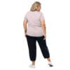 Woman in pink shirt and black pants.