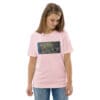 Woman in pink shirt with art print.