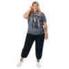 Woman in gray T-shirt with art print.