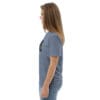 Woman in blue t-shirt with art.