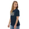 Woman in blue t-shirt with artwork.