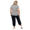 Woman in grey shirt and black pants, back view.