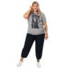 Plus-size model in grey art t-shirt.