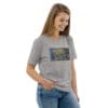 Woman in gray t-shirt with artwork.