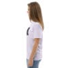 Woman in white t-shirt with artwork.