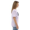 Woman in white t-shirt with artwork.