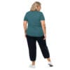 Woman in teal shirt and black pants.