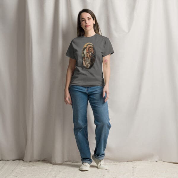 Woman in gray t-shirt with religious art.