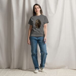 Woman wearing grey graphic tee and jeans
