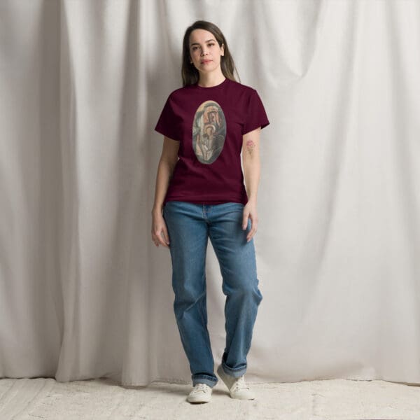 Woman in maroon t-shirt with religious art.