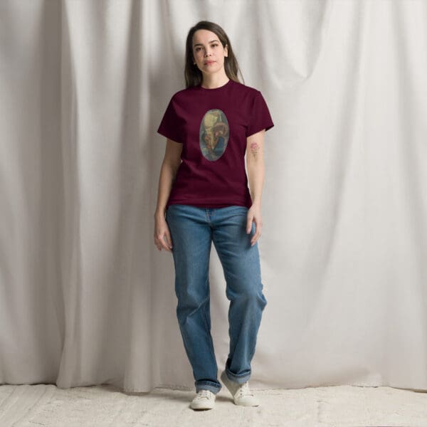 Woman in maroon t-shirt with artwork.