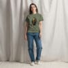 Woman in olive t-shirt with artwork.