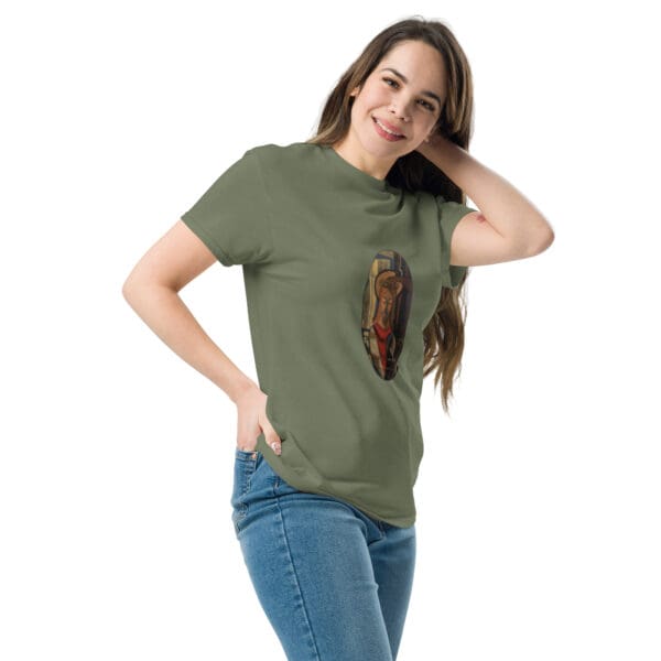 Woman in olive tee with art print.