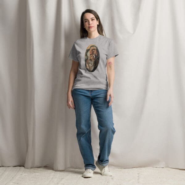 Woman in grey t-shirt with religious art.