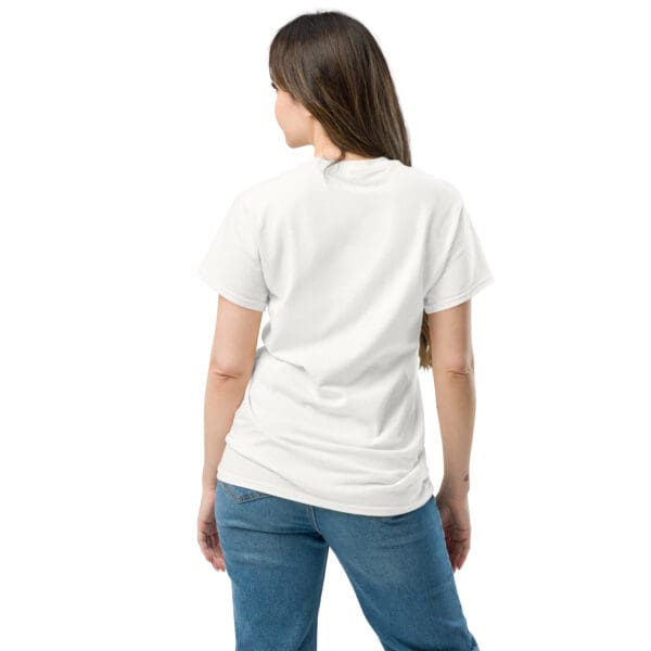 Woman in white shirt, jeans, back view.