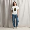 Woman in white T-shirt with artwork.