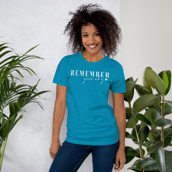 Woman wearing "Remember your why" tee.