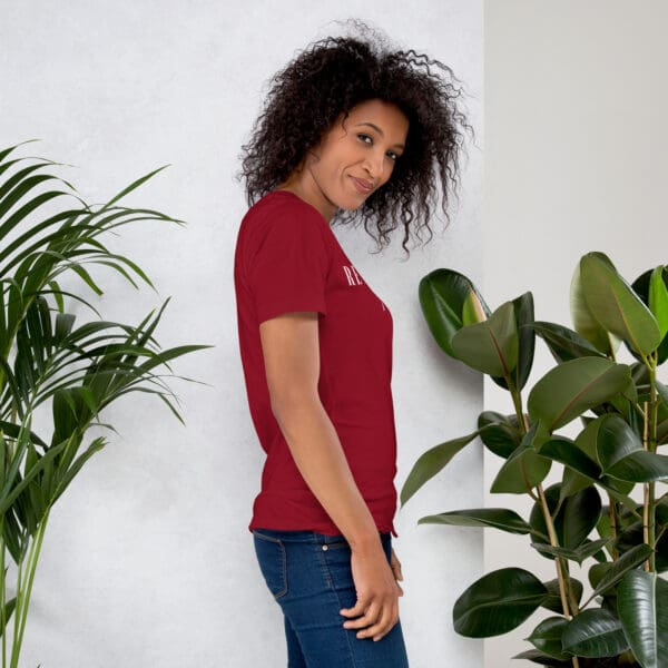 Woman in red shirt, side profile.