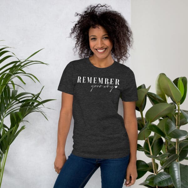 Woman in Remember Your Why shirt.