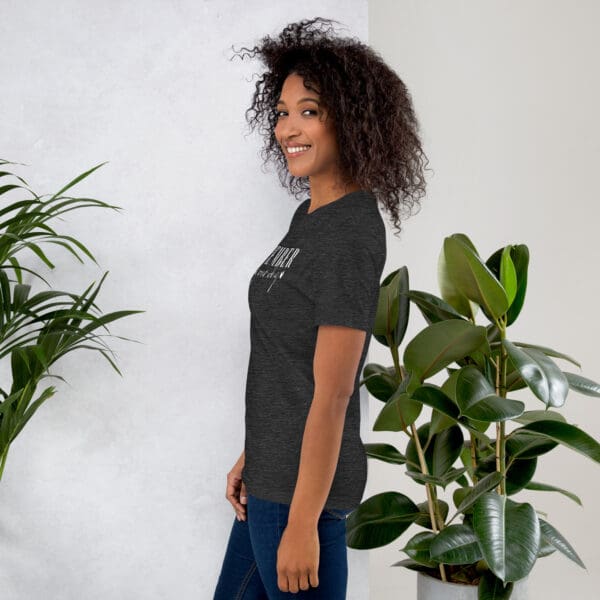 Woman wearing dark gray graphic tee.