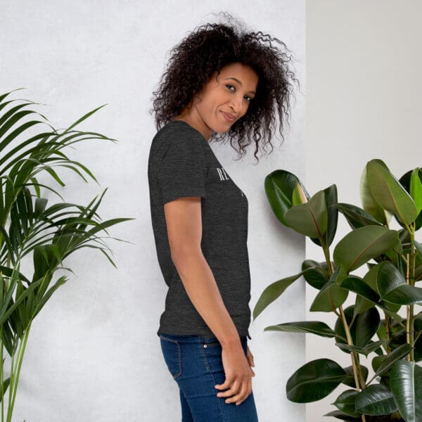 Woman in dark gray shirt, side view.