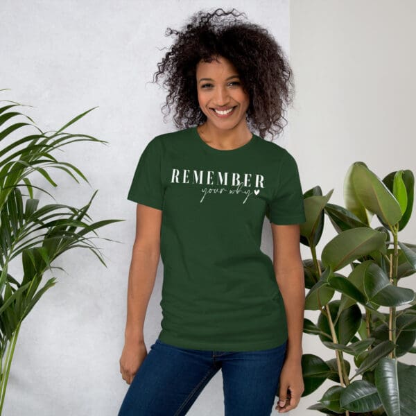 Woman in green "Remember your why" shirt.