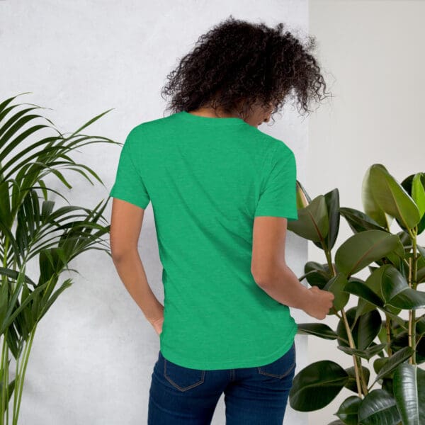 Woman in green t-shirt, back view.