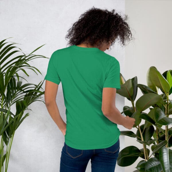 Woman in green t-shirt, back view.