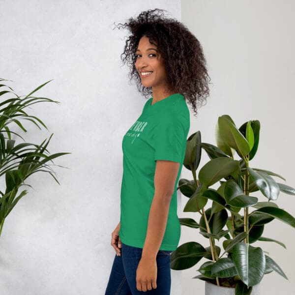 Woman in green t-shirt, side view.