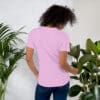 Woman in pink t-shirt, back view.
