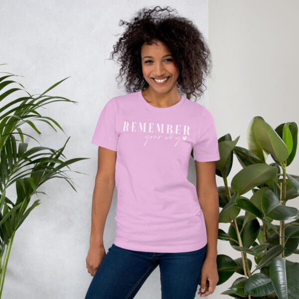 Woman in pink "Remember your why" shirt.