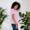 Woman in pink t-shirt, side profile.