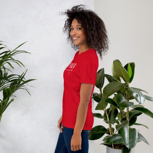 Woman in red shirt, side view.