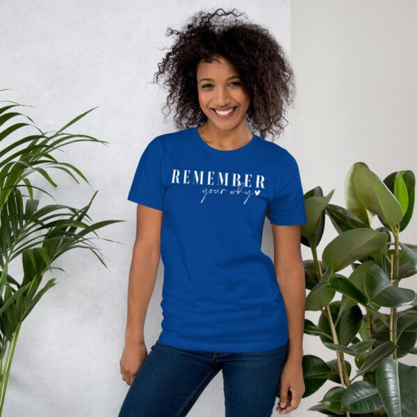 Woman in blue "Remember your why" shirt.