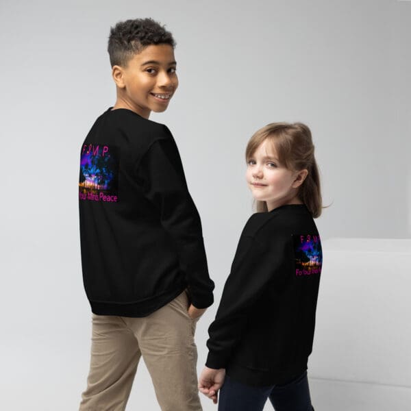 Kids in black sweatshirts, back view.