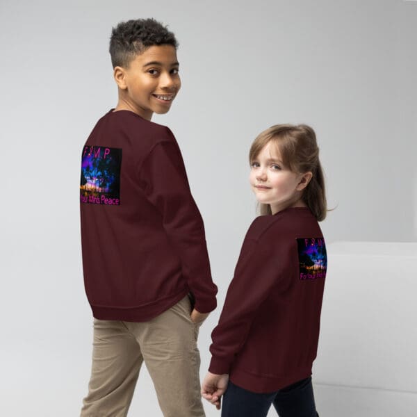 Kids in maroon sweatshirts, peace design.