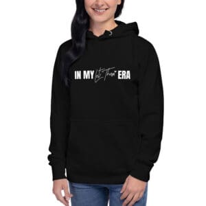 Person in black hoodie with stylish text.