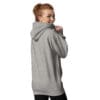 Smiling woman wearing a gray hoodie.