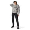 Woman in gray hoodie and black jeans.