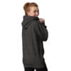 Smiling woman wearing a dark hoodie.