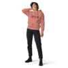 Woman in hoodie and black jeans.
