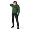 Woman in green hoodie and black jeans.