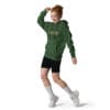 Person dancing in a green hoodie outfit.