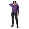 Woman in purple hoodie and black jeans.